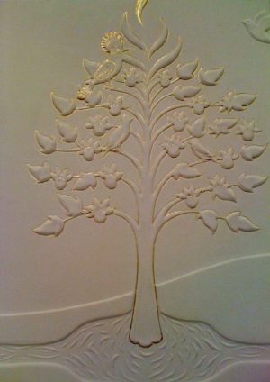 "Tree of Life": moulded and gilded leather panel by Jorge Centofanti, representing the four rivers of Paradise meeting at a fountain from which the Tree of Life grows. 1997. Waterer Spiors Colection, Museum of Leathercraft